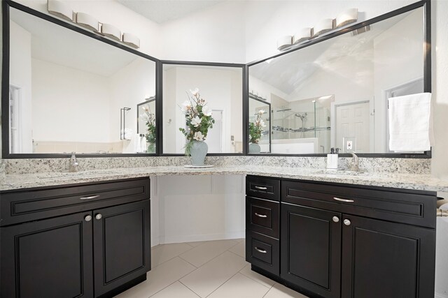 bathroom featuring tile patterned flooring, an enclosed shower, vanity, and a healthy amount of sunlight