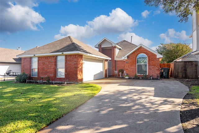 view of front of house with a garage and a front lawn