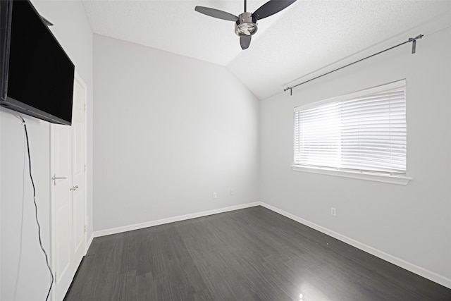 unfurnished bedroom featuring a textured ceiling, lofted ceiling, ceiling fan, and dark hardwood / wood-style floors