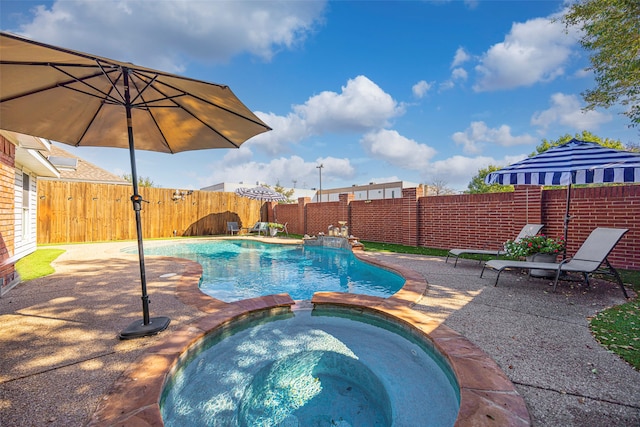 view of pool with a patio and an in ground hot tub