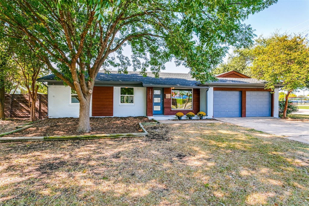 ranch-style home with a garage