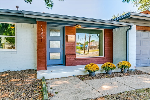 entrance to property featuring a garage