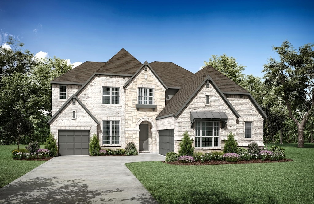 french country inspired facade featuring roof with shingles, concrete driveway, a front yard, and stone siding