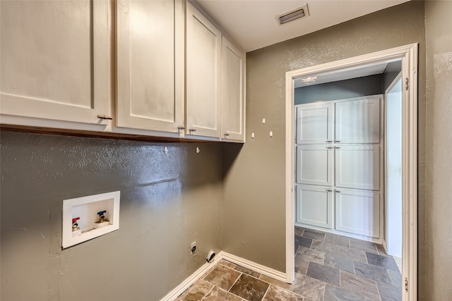 laundry area with electric dryer hookup, cabinets, and hookup for a washing machine