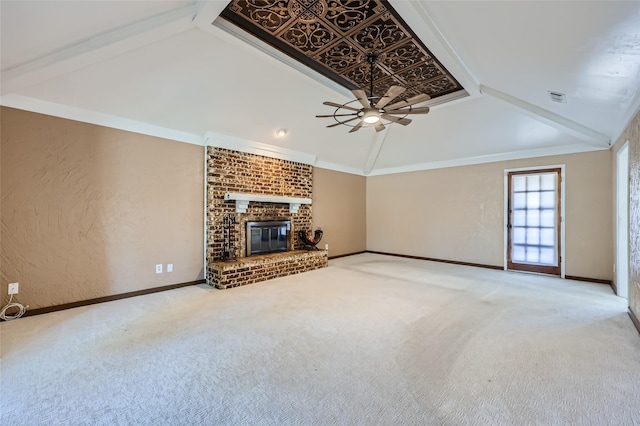 unfurnished living room with carpet, lofted ceiling, a brick fireplace, ceiling fan, and ornamental molding