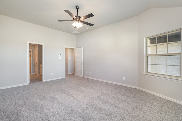 unfurnished bedroom with lofted ceiling, light colored carpet, and ceiling fan