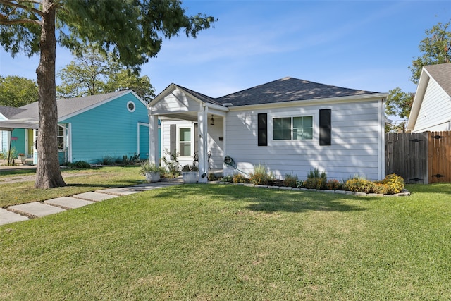 single story home with a front yard