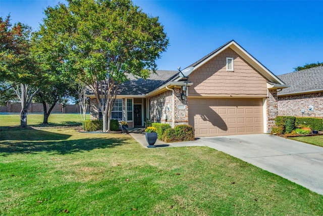 view of front of property with a garage and a front lawn