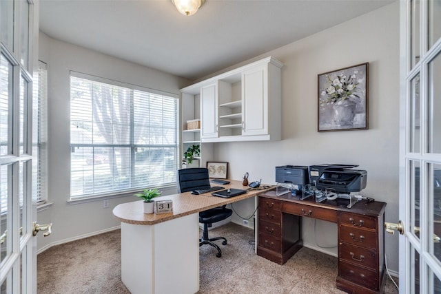 carpeted office featuring french doors