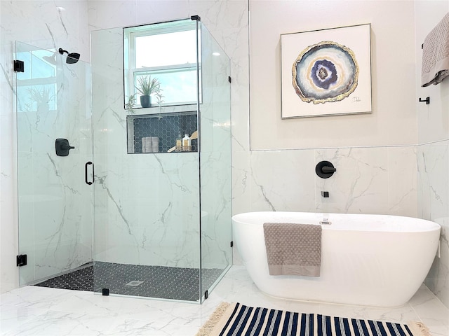 6213 Turkey Oak, Royse City, TX 75189 - bathroom with a marble finish shower, a freestanding tub, marble finish floors, wainscoting, and tile walls