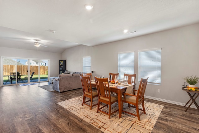 dining room featuring lofted ceiling, hardwood / wood-style flooring, and ceiling fan