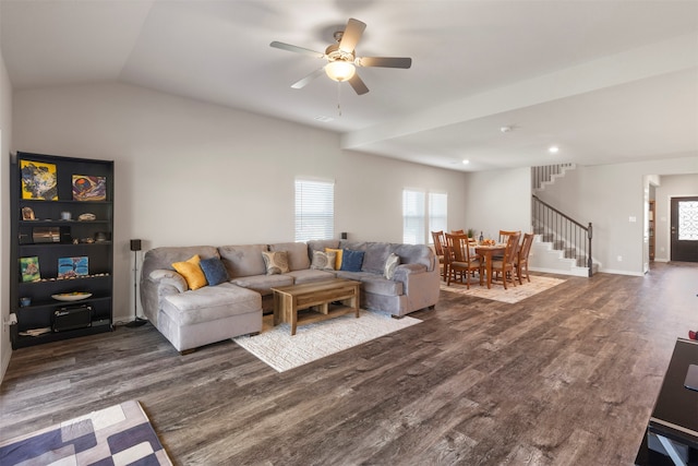 living room featuring lofted ceiling, ceiling fan, and dark hardwood / wood-style flooring