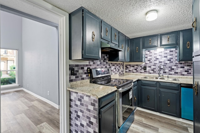 kitchen with black / electric stove, sink, backsplash, light stone countertops, and light hardwood / wood-style flooring