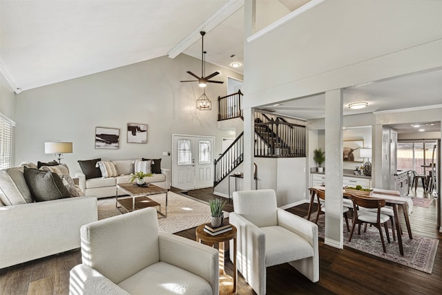 living room with high vaulted ceiling, beamed ceiling, dark hardwood / wood-style flooring, ornamental molding, and ceiling fan