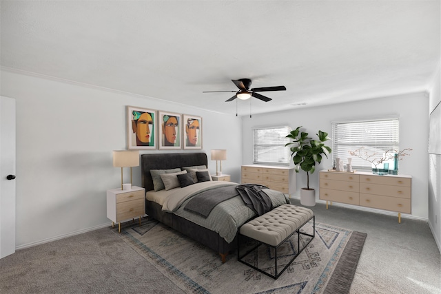 bedroom with carpet, ceiling fan, and crown molding