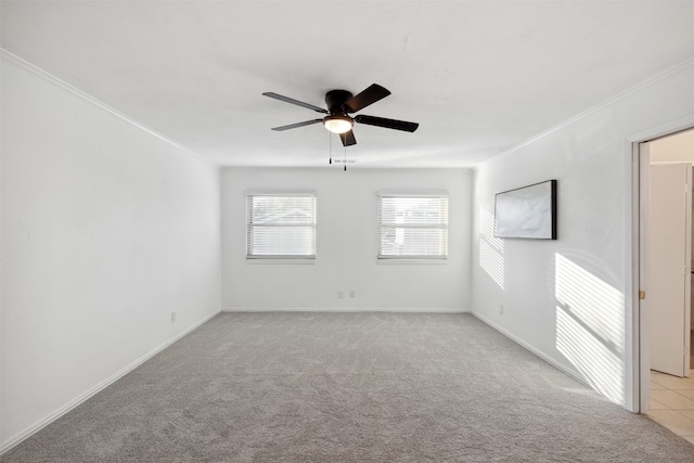 unfurnished room with light carpet, ceiling fan, and ornamental molding