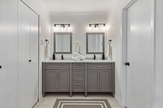 bathroom featuring tile patterned flooring, vanity, and ornamental molding