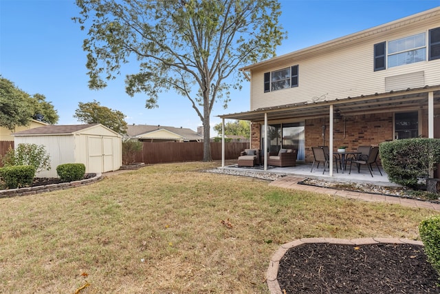 view of yard with an outdoor hangout area, a shed, and a patio area