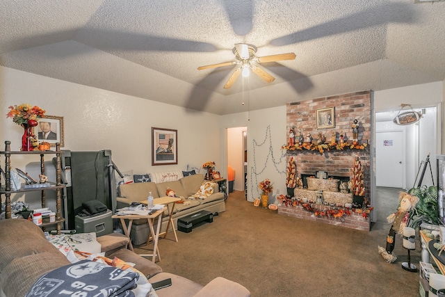 carpeted living room with a textured ceiling, a brick fireplace, a tray ceiling, lofted ceiling, and ceiling fan