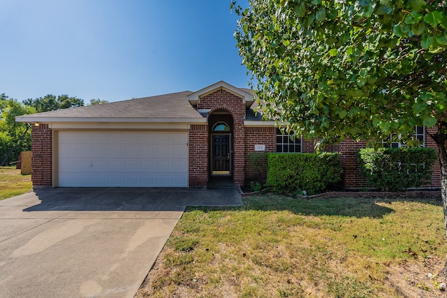 ranch-style home featuring a front yard and a garage