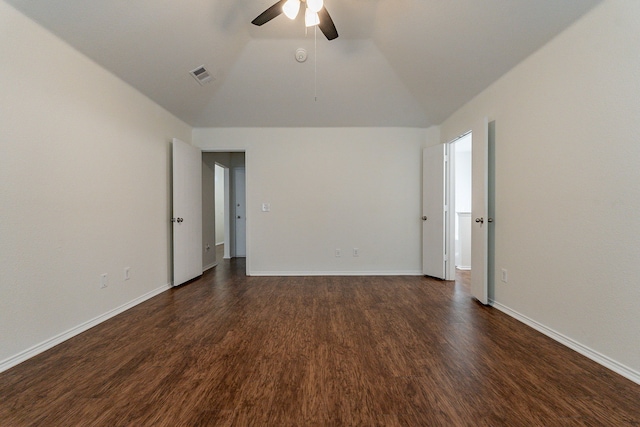 spare room with ceiling fan, lofted ceiling, and dark hardwood / wood-style floors