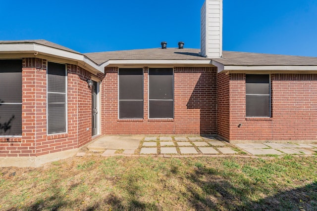 rear view of house featuring a patio