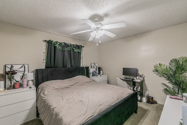 carpeted bedroom with a textured ceiling and ceiling fan