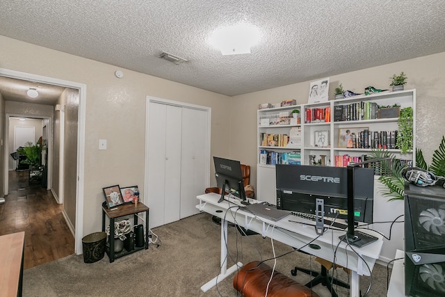 office space with a textured ceiling and hardwood / wood-style flooring