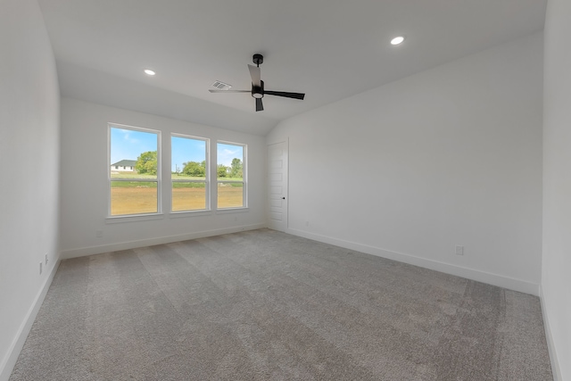 unfurnished room featuring ceiling fan and carpet flooring