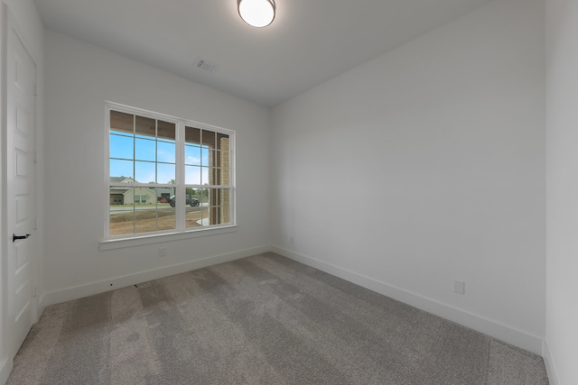 empty room featuring carpet floors