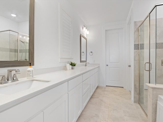 bathroom featuring vanity and an enclosed shower