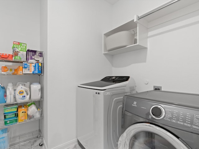 laundry area featuring washer and clothes dryer