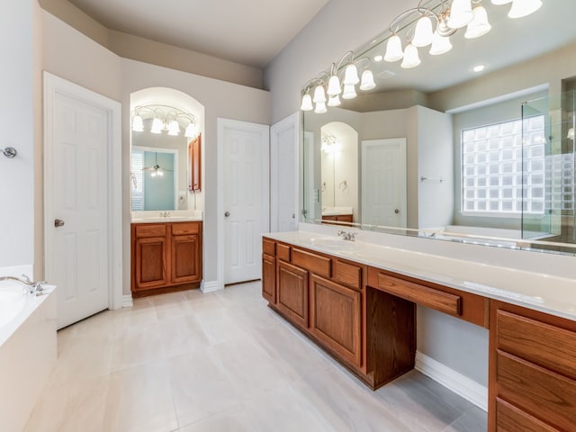 bathroom featuring vanity and shower with separate bathtub