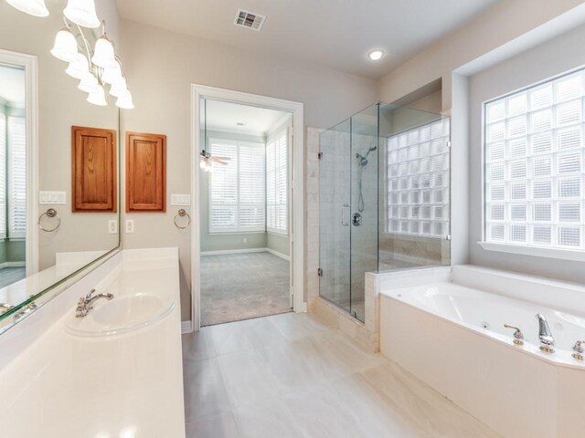 bathroom featuring vanity, ceiling fan, and independent shower and bath