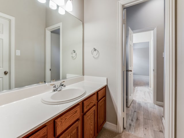 bathroom featuring vanity and hardwood / wood-style floors