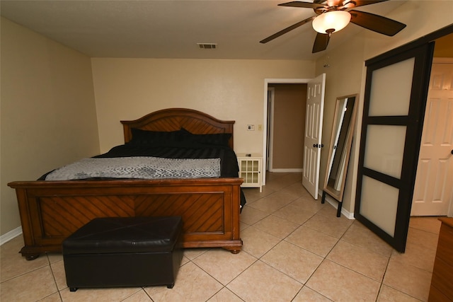 bedroom with light tile patterned flooring and ceiling fan