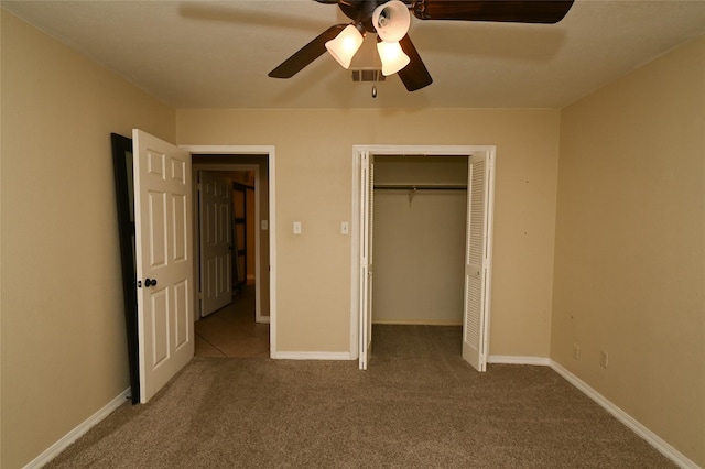 unfurnished bedroom with a closet, ceiling fan, and carpet