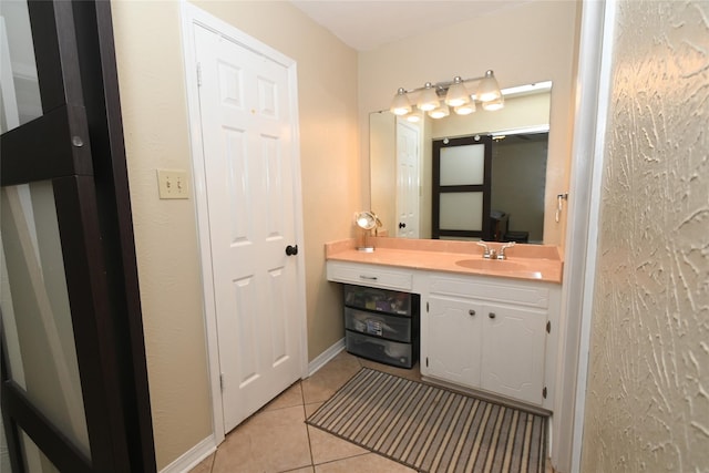 bathroom with vanity and tile patterned floors