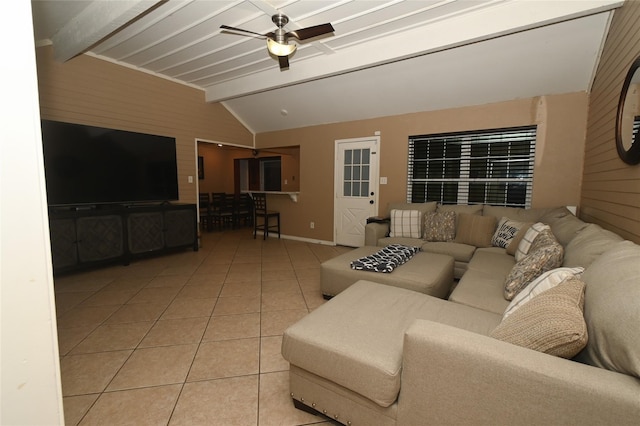 tiled living room with vaulted ceiling with beams and ceiling fan