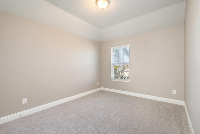 carpeted empty room with ornamental molding, ceiling fan, and a tray ceiling