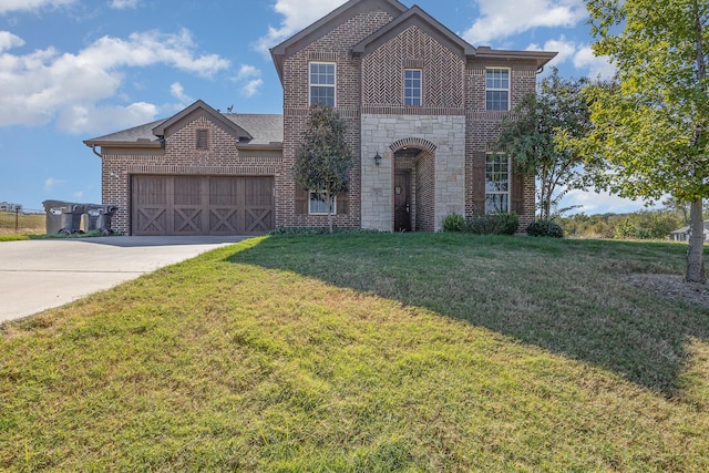 view of front of house with a garage and a front yard