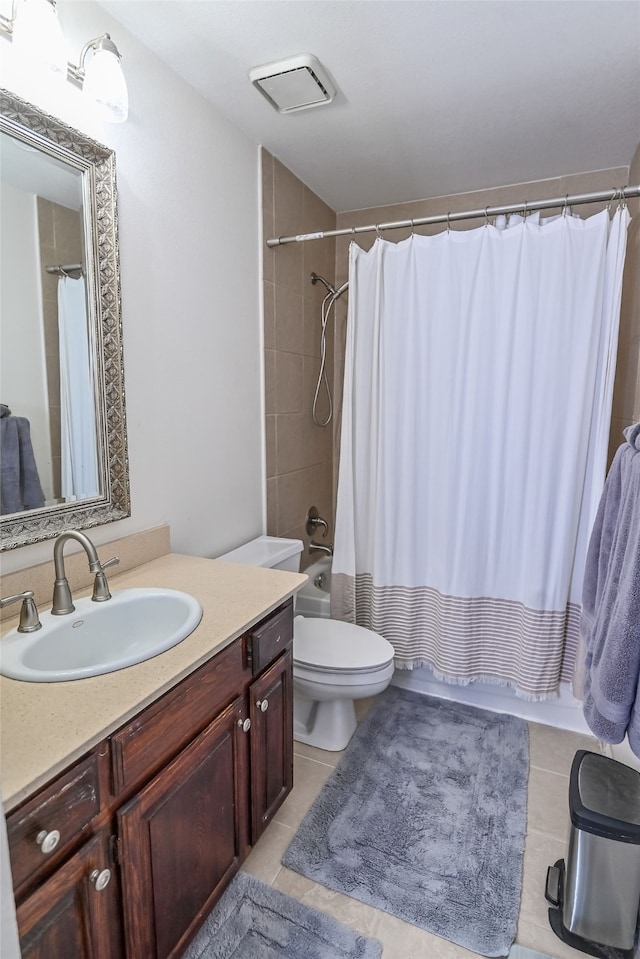 full bathroom with vanity, tile patterned floors, toilet, and shower / bathtub combination with curtain