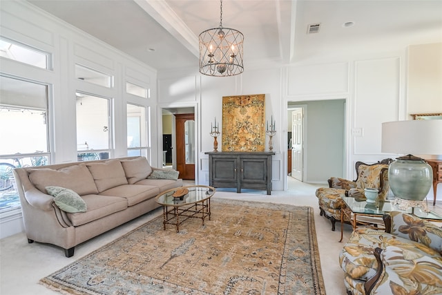 carpeted living room featuring crown molding, beam ceiling, a chandelier, and a high ceiling