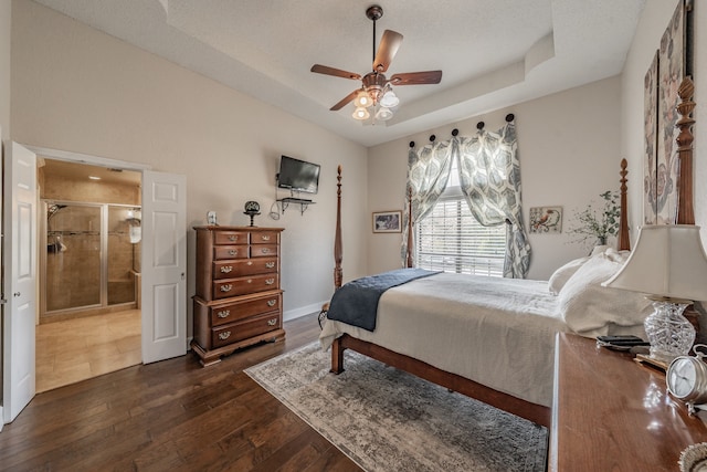 bedroom with a textured ceiling, dark hardwood / wood-style floors, and ceiling fan