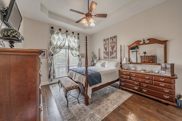 bedroom featuring ceiling fan and dark hardwood / wood-style flooring