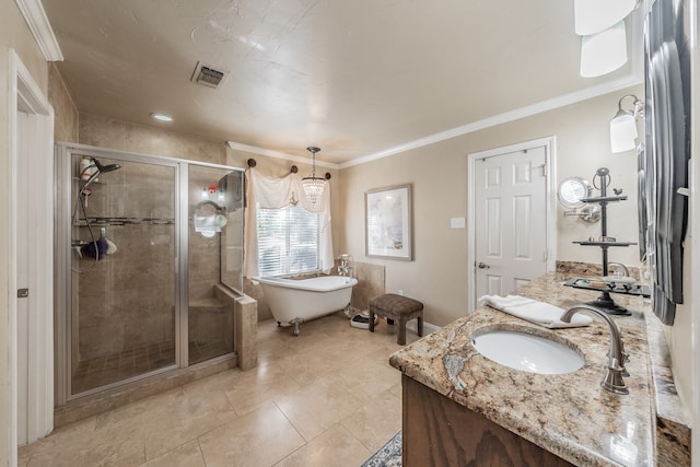 bathroom with vanity, crown molding, and separate shower and tub