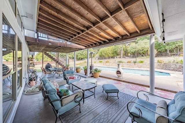 view of patio / terrace featuring an outdoor living space and a fenced in pool