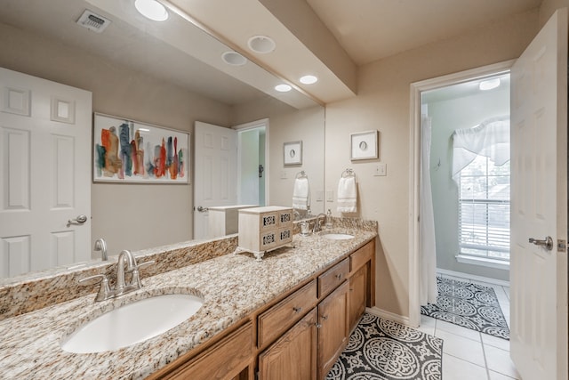 bathroom with vanity and tile patterned floors