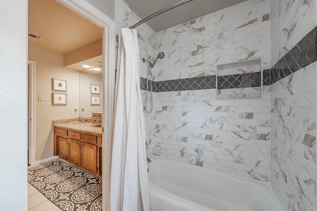 bathroom with vanity, tile patterned floors, and shower / bath combo