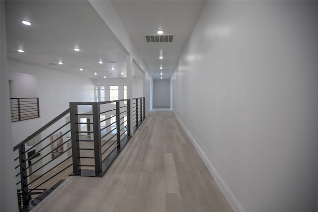 corridor with light wood-type flooring